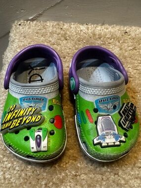 Toddlers Light Up Toy Story Crocs. Slight wear and tear visible in photos.